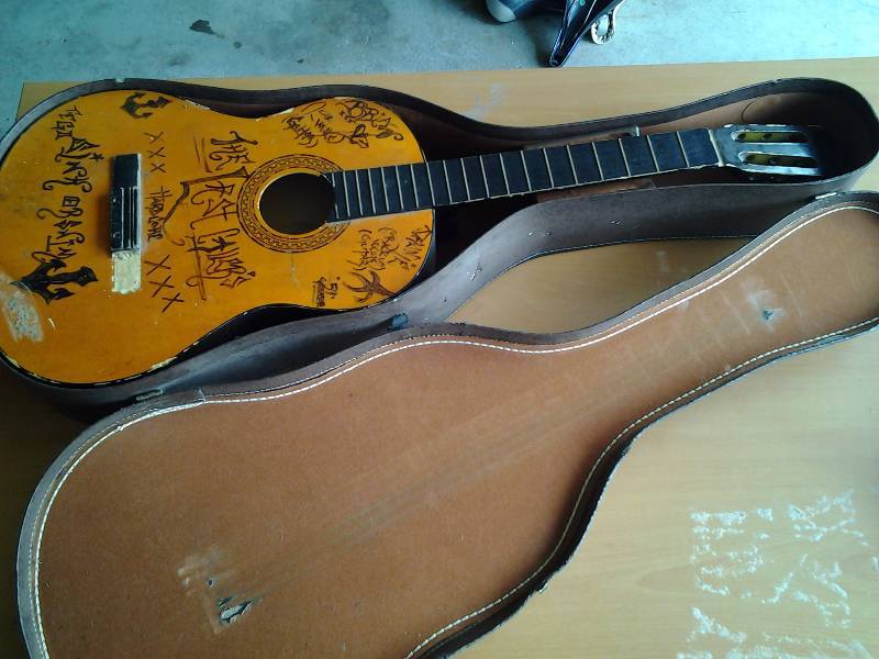 lot 9 image: Acoustic Guitar Melody Model # 851, With Last Callers Band Graffiti, Includes Hard Case