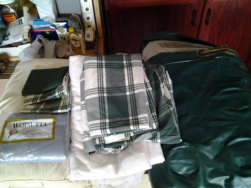 lot 57 image: Coleman Inflatable 2 Person Bed, Mattress Pads, New Queen Size Flat Sheet Set, 1-Twin Set