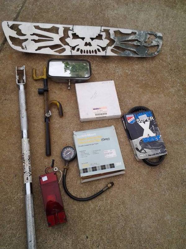 lot 64 image: Large Lot Of Automotive Related-38 Inch Grill Cover, Tail Light, Mirror, Belt, Wheel Lock, Compression Gauge