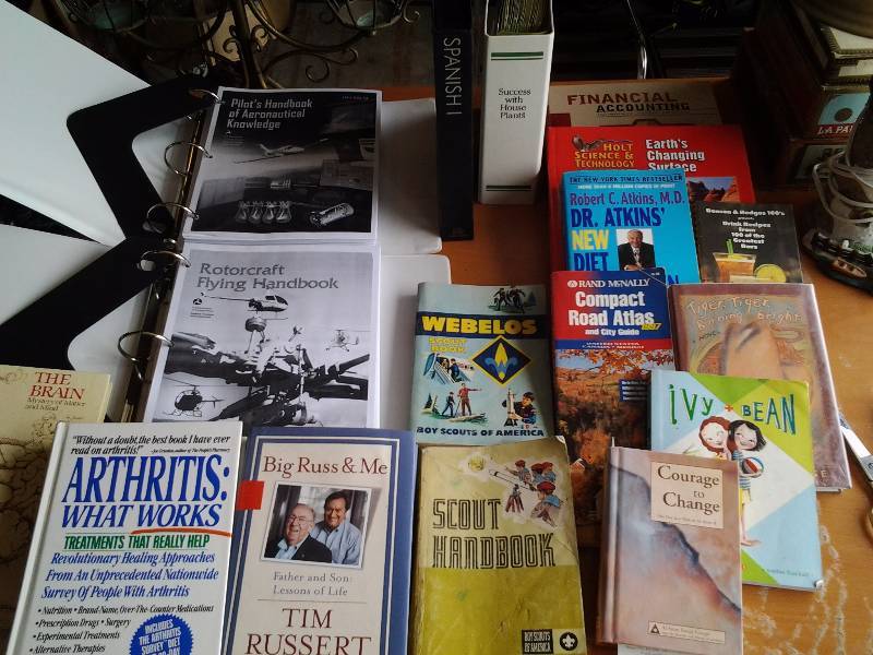 lot 65 image: Lot Of Books, Pilot Manuals, Scouts, Plants. The Body, Pimslear Spanish I CD Set