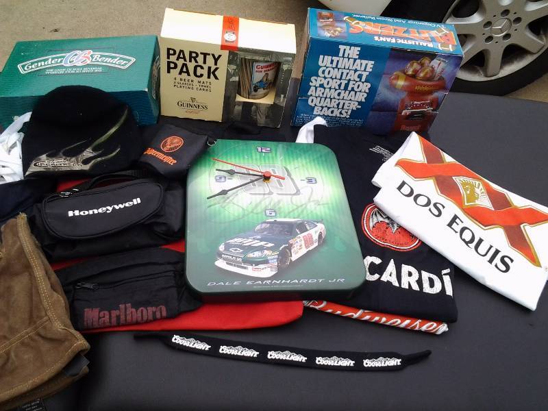 lot 67 image: Lot Of Guinness Party Glass, Games, Dale Earnhardt Jr. Clock, Beer T-Shirts, Hats, Misc