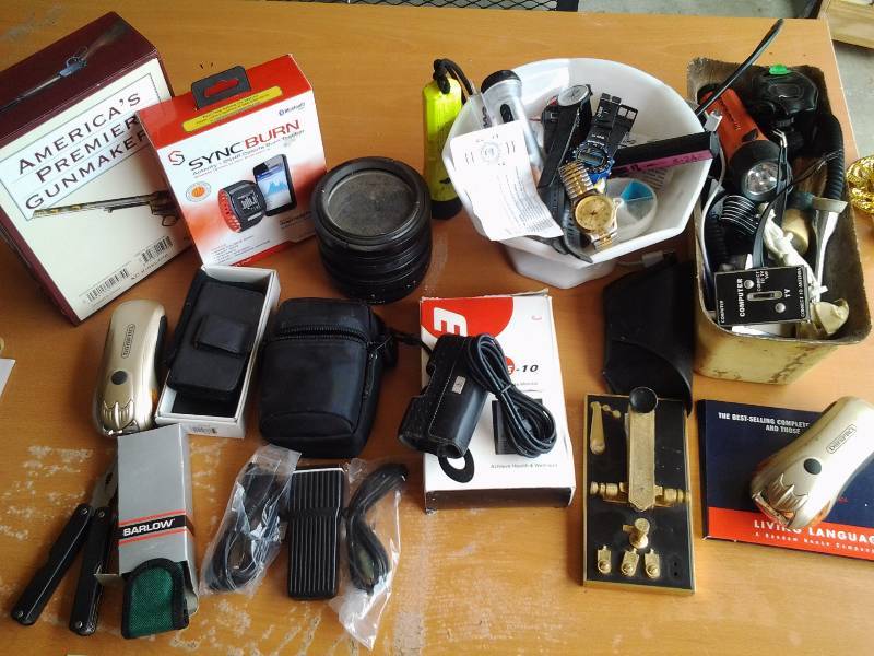 lot 101 image: Electronic Related & Misc Razors, Cell Phone Cases, Watches, Flashlights, 80.7 Bausch & Lomb Lens, Multi Tool