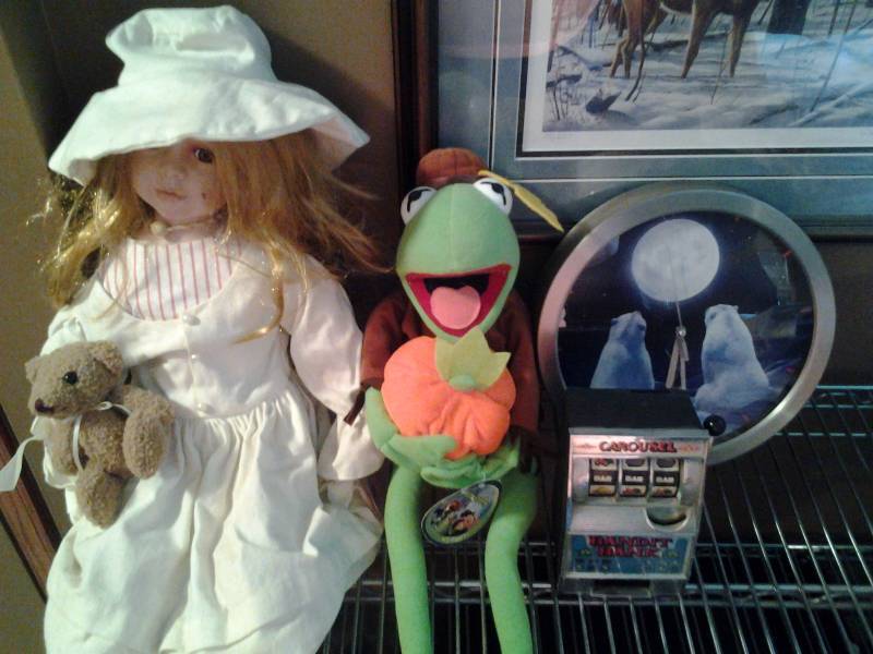 lot 125 image: Porcelain Doll, Kermit The Frog, Coca Cola Clock, Slot Machine Bank