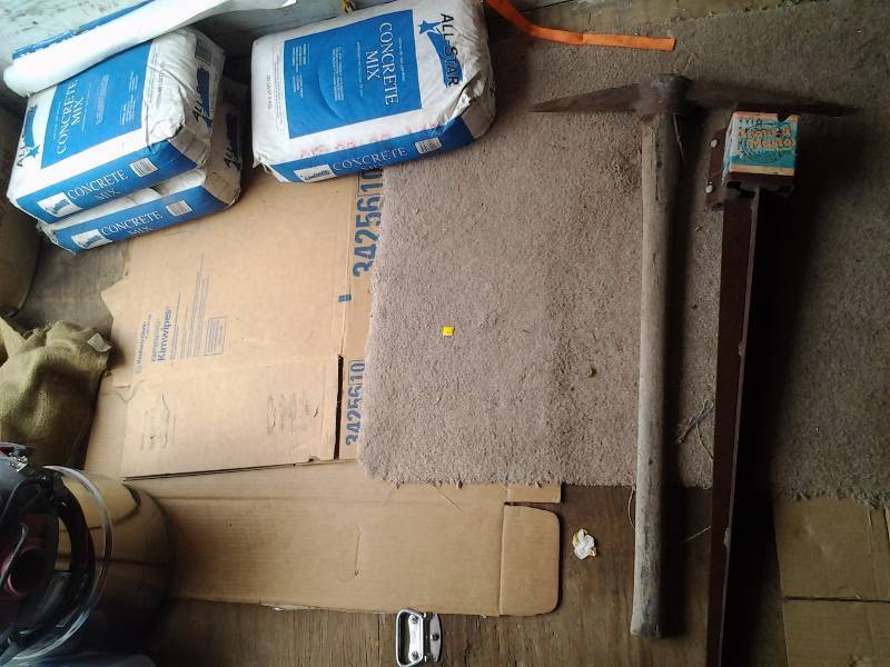 lot 141 image: 3-Bags Concrete Mix, Pick Axe, Post