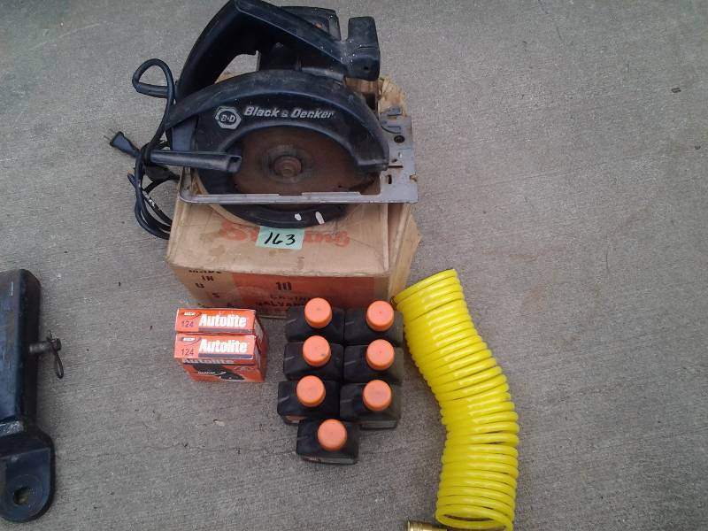 lot 163 image: Box Of Galvanized FinishCasement Nails, 2 Set Of Autolite Spark Plugs, 7 Bottles Of 2 Cycle Oil, Coiled Aie Hose With Quick Connects, B &D Skil Saw