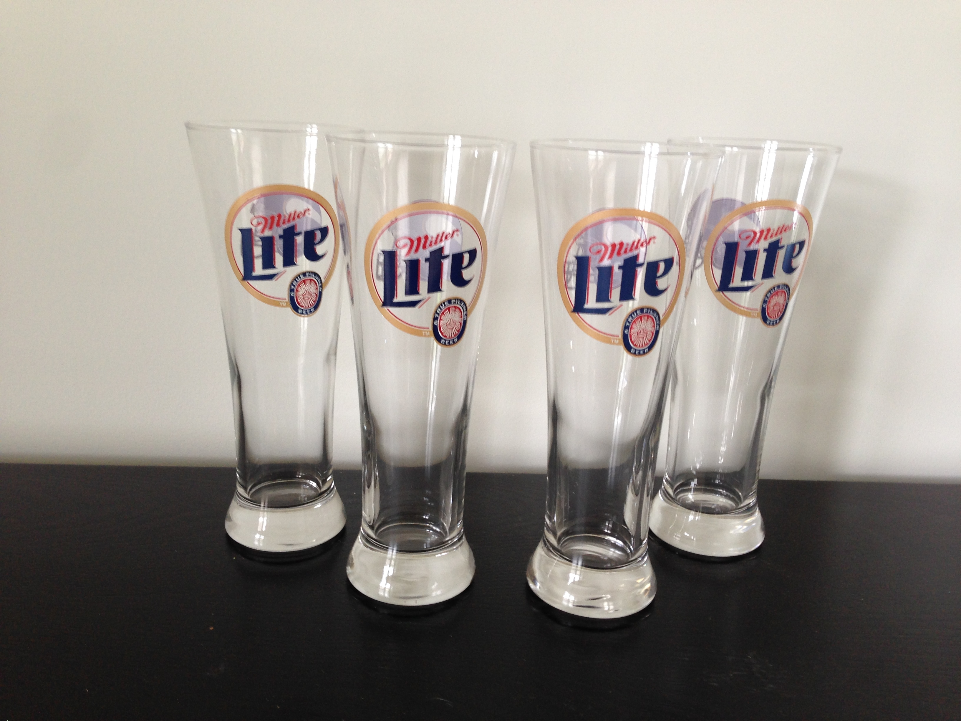 lot 68 image: 4 Miller Lite Vikings Glasses