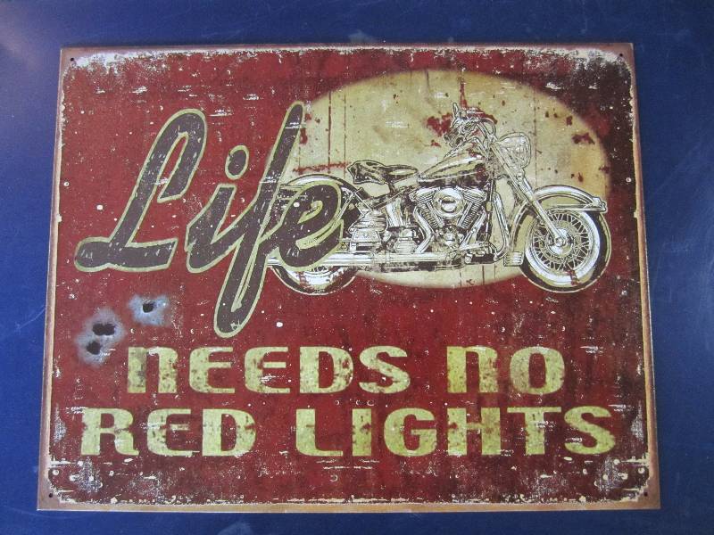 lot 98 image: Metal sign. Life needs no red light...