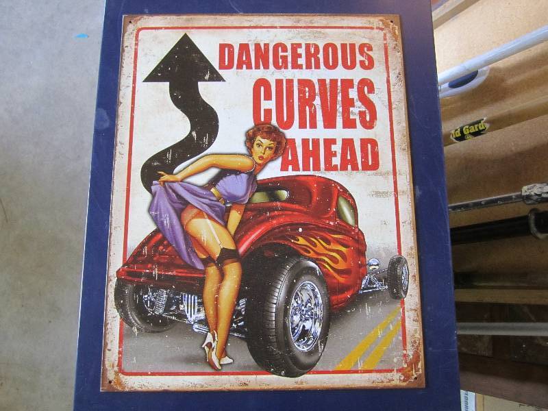 lot 103 image: Metal sign. Dangerous Curves Ahead....