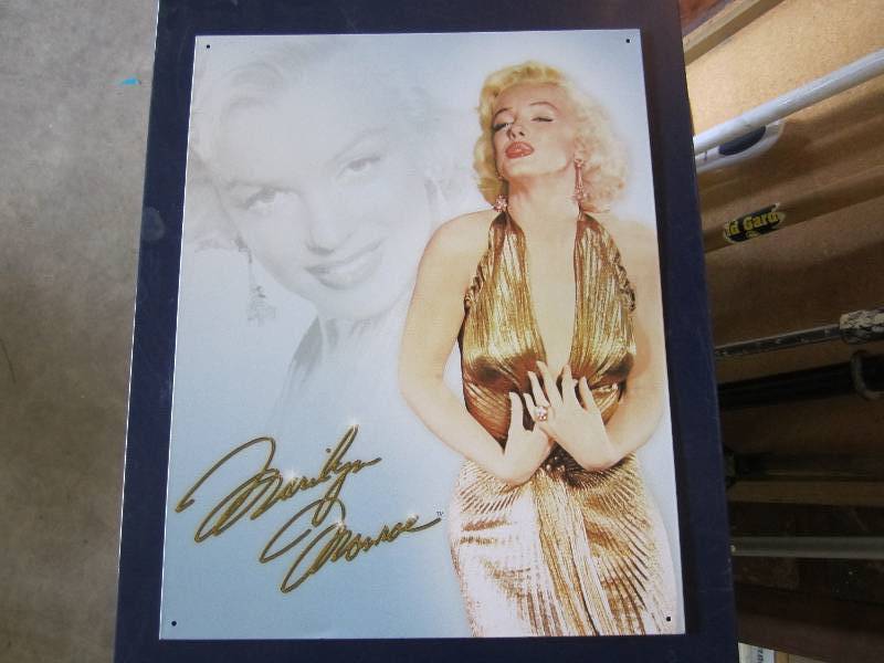 lot 104 image: Metal sign. Marilyn Monroe 12.5 x ...