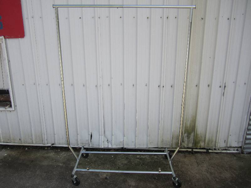 lot 127 image: Metal clothes rack on wheels. Break...