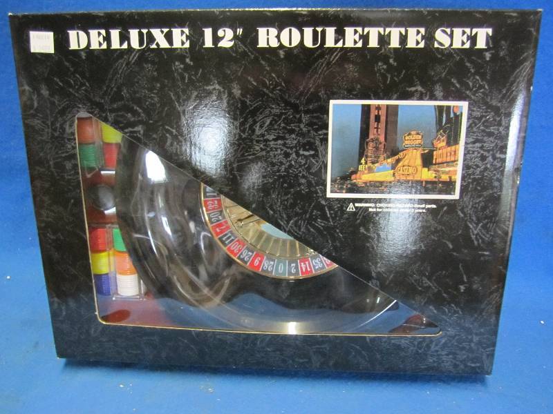 lot 141 image: Deluxe 12 roulette set. Looks to b...
