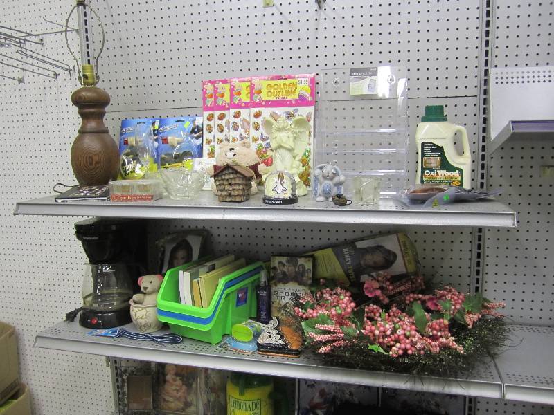 lot 142 image: Large resale lot. 4 shelves full of...