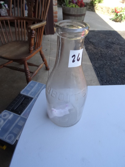 lot 26 image: Abbotts vintage milk bottle...