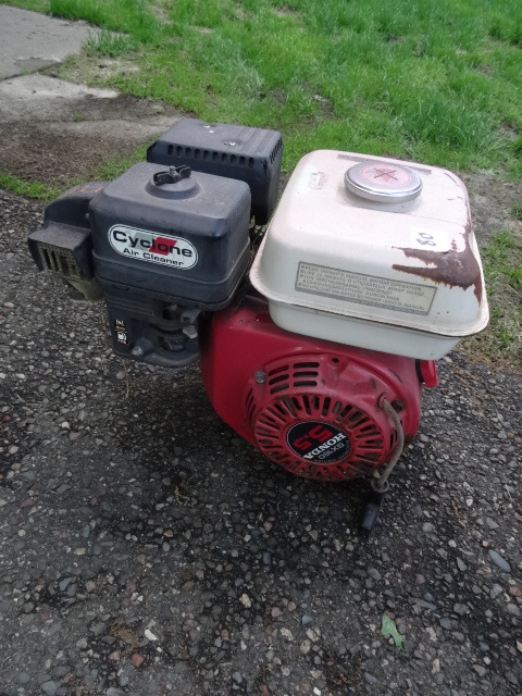 lot 80 image: Honda 5 HP motor. For parts only....