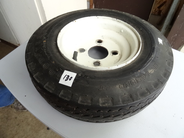 lot 130 image: 4.80-8 goodyear tire and 4 lug rim...