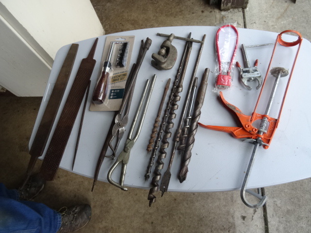 lot 142 image: Drill bits. Caulking gun. Ratchetin...
