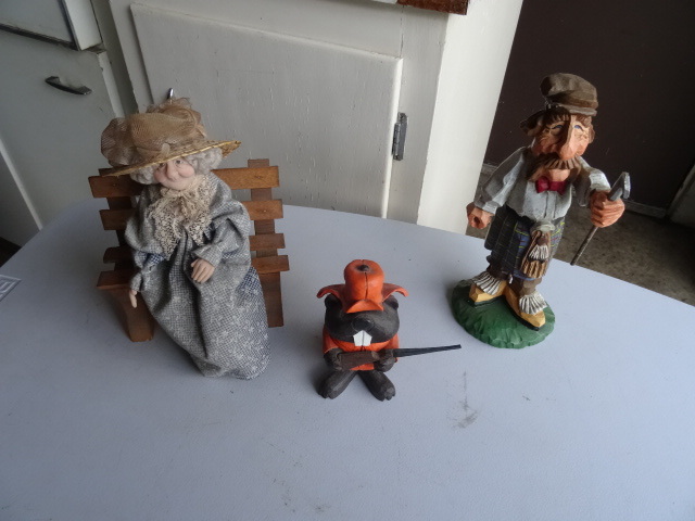 lot 189 image: Golfer, Beaver, and old lady figuri...