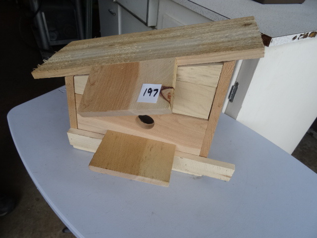lot 197 image: Cedar wood bird house. New....