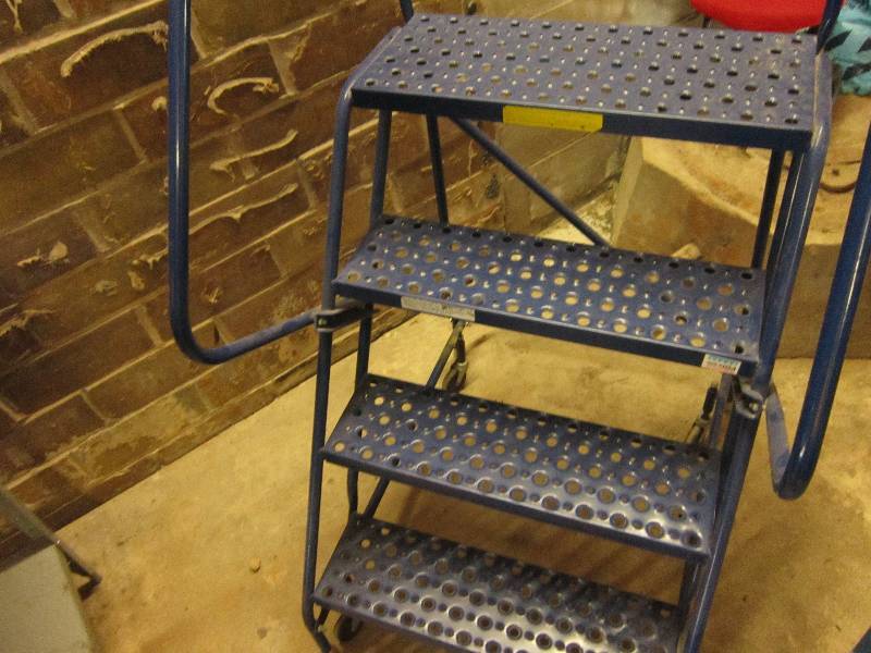 Rolling step ladder, top step is 38...