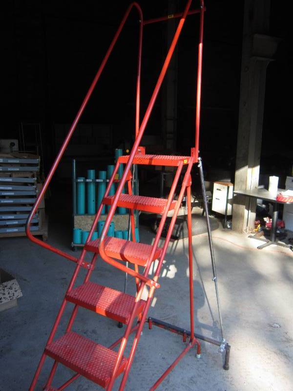 Roling step ladder, top step is 56...