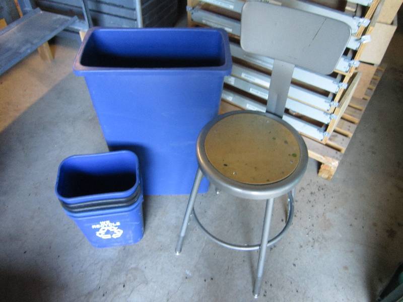 Lot of recycling cans and a stool...