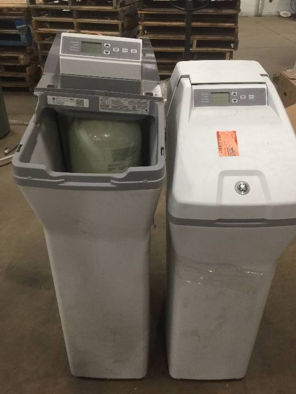 lot 4 image: Lot of 2 Grain Water Softener Systems models GXSF30V  (30,000) and GE GXSH45V 45,000