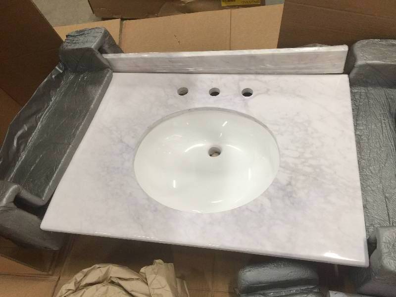 lot 25 image: Home Decorators Collection 31 in. Stone Effects Vanity Top in Carrera with White Basin. SEB3122COM-CE open box never used