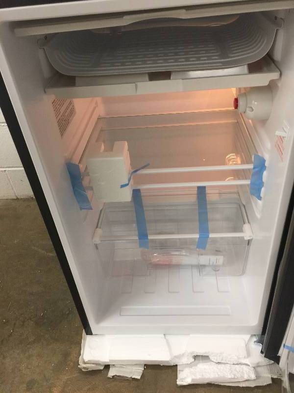 lot 59 image: Magic Chef 3.5 cu. ft. Mini Refrigerator in Stainless Look, ENERGY STAR open box never used whit small damage in the side