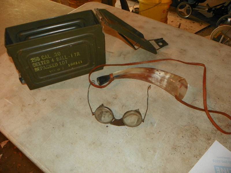 lot 121 image: METAL AMMO BOX, POWDER HORN AND OLD SAFETY GLASSES