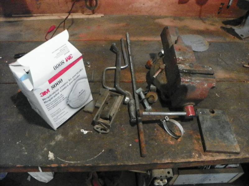 lot 154 image: BENCH VISE, DUST MASKS AND MISC ITEMS