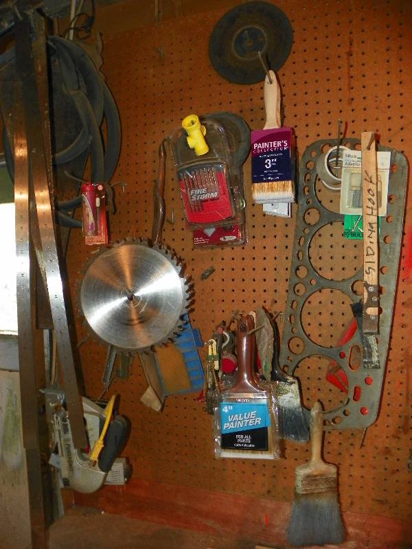 lot 159 image: SAW BLADE, PAINT BRUSHES, RULERS AND MISC ON WALL