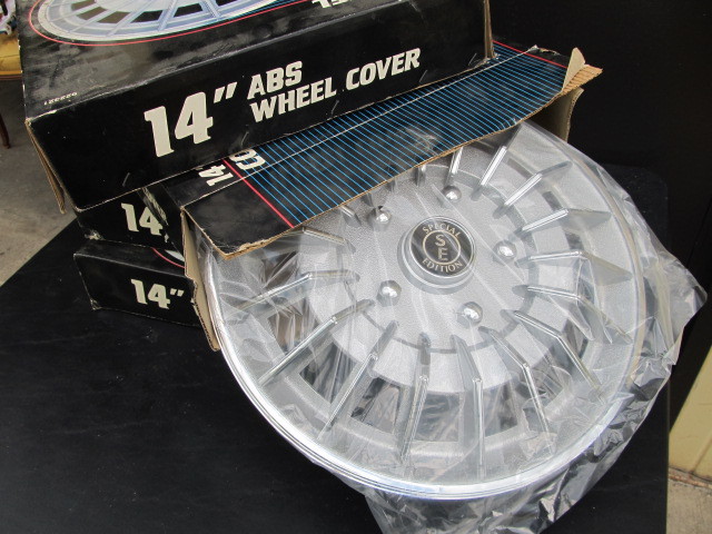 lot 65 image: 4 Vintage NIB Wheel Covers