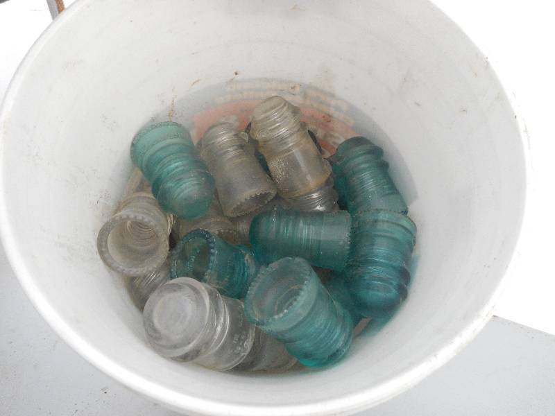 lot 21 image: ANTIQUE GLASS INSULATORS