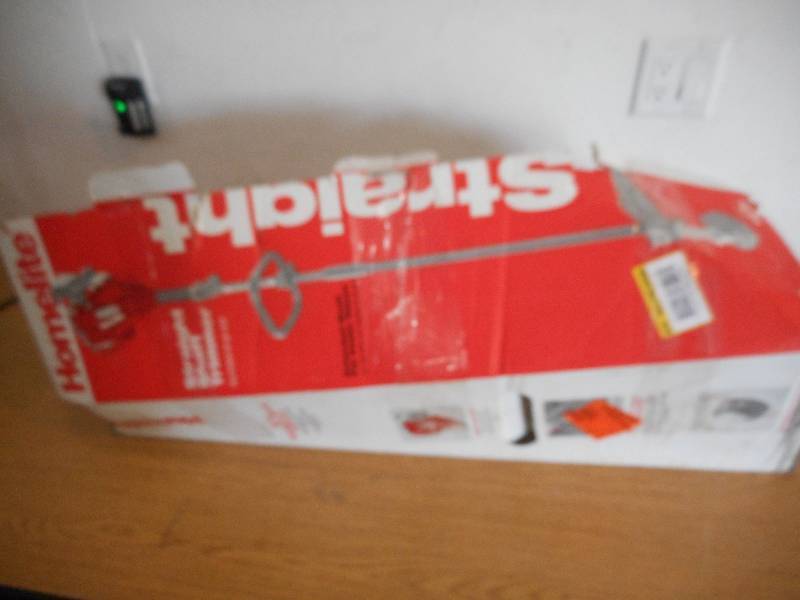 lot 32 image: Homelite 2-Cycle 26cc Straight Shaft Gas Trimmer