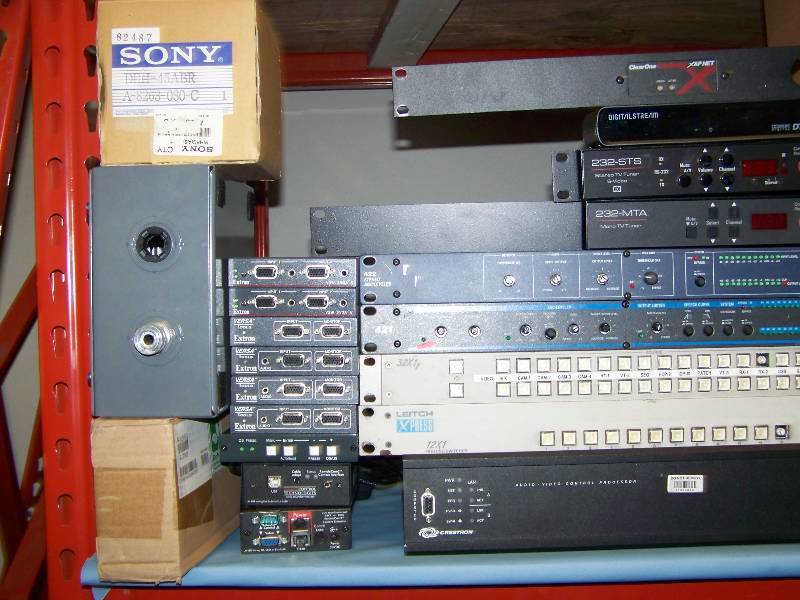 lot 72 image: (8 wide shelf) LARGE LOT of Audio  Video (AV) items including Switchers  TV Tuners  Wall Plate Controls  Controllers  Amplifiers  Receivers  Mounts and more