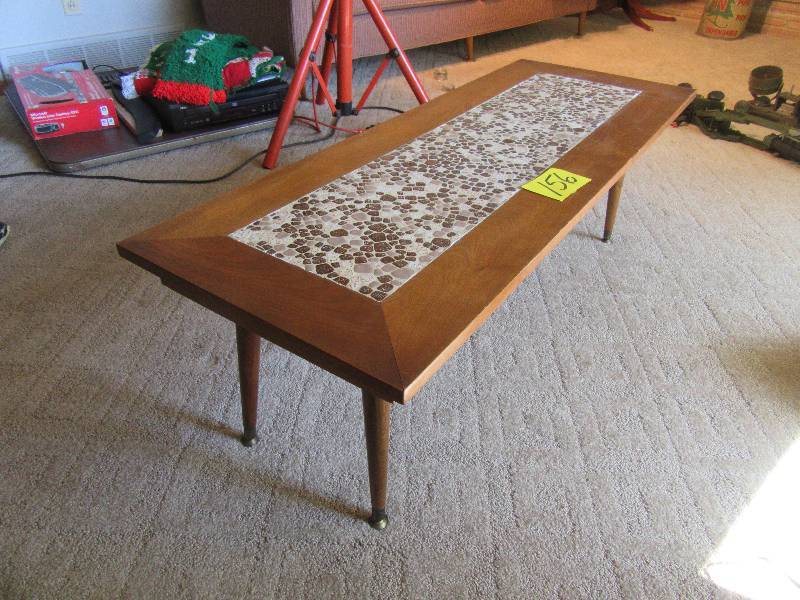 lot 156 image: Coffee table with stone inlay in center.. Nice walnut legs and frame.