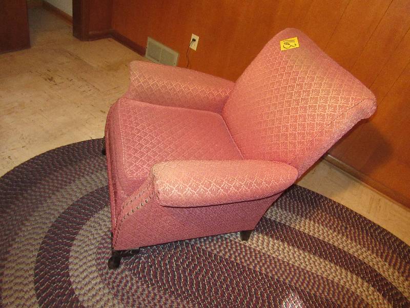 lot 163 image: Nice Vintage over stuffed chair.. Nice tack design and wood claw type legs.. Upholstery is in good shape, but a little faded.