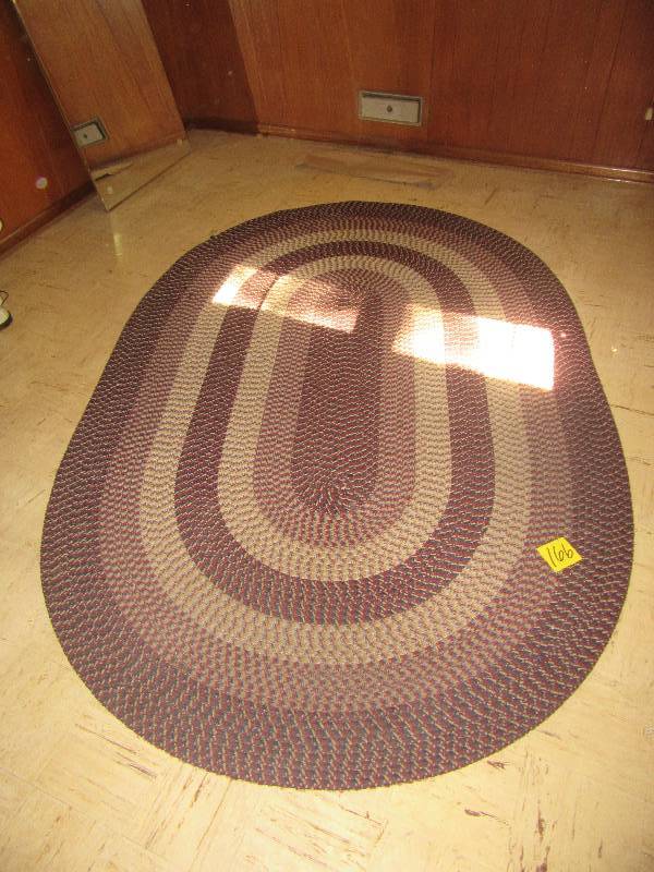 lot 166 image: Nice braded rug. Good shape and clean.  66in x 98 in