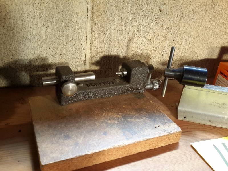 lot 112 image: 2 Bullet Casing SizingTrimmer (1 missing handle)  Some type of Mould (his dad made this).
