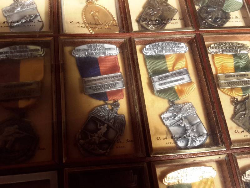 lot 124 image: Large lot of Shooting metalawards.  Not sure of the metal