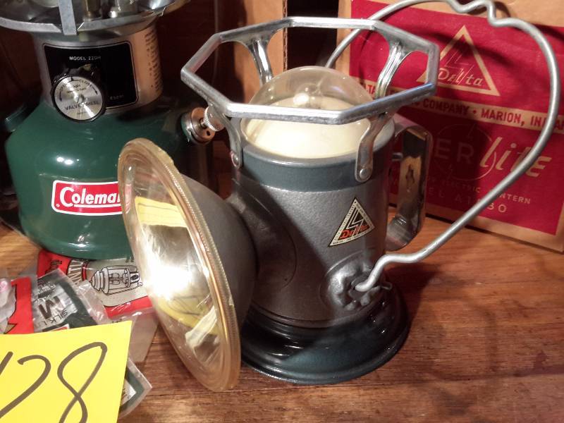 lot 128 image: Coleman Lantern (looks like it was never used) Lantern like flashlight..