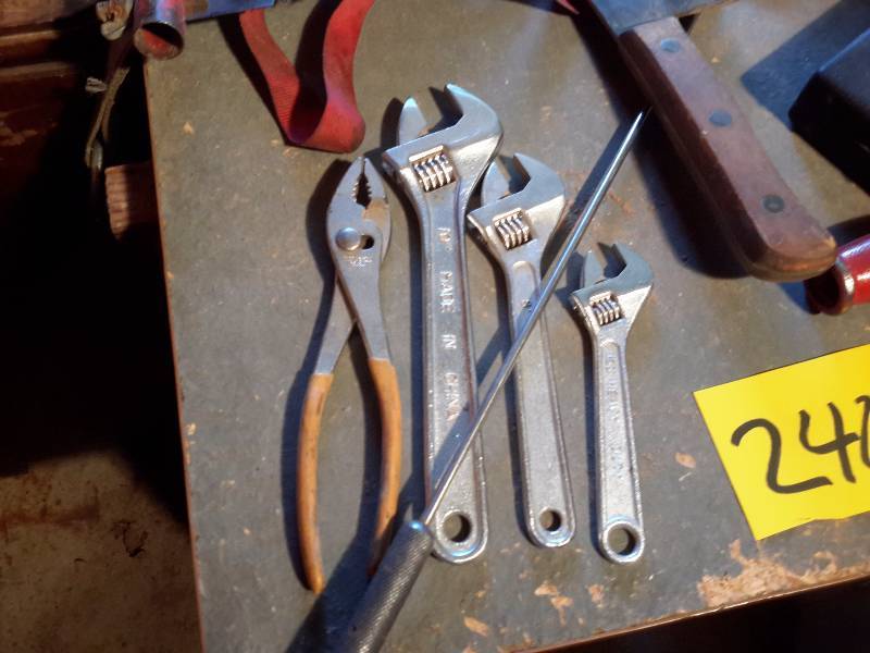 lot 240 image: Misc. Tools as pictured  Cross cut saw, 3 crescent wrenches,  Pipe Flaring tool,  MIDLAND 13 Transistor  walkie Talkie type radio Meat Cleaver and more.. See closeups