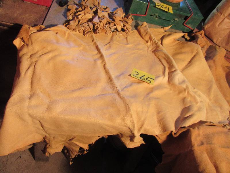 lot 265 image: 2 large SOFT TANNED Deer Hides and misc. small pieces.