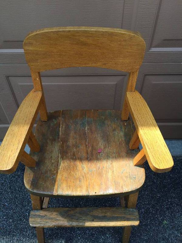 lot 13 image: Beverly Discovered This Antique High Chair Playing With Her Boyfriend Back In An Old Barn Over 60 Years Ago...Back Then She Had The Back & The Arms Repaired...Oh And She Married The Boyfriend Too