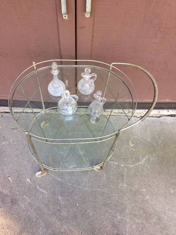 lot 30 image: Vintage Mid Century Modern Oval Chrome & Glass Bar Cart Trolley - Metal Needs Updating & Glass Has Small Chipping Around The Edges - No Cracks Though - Cruets Not Included