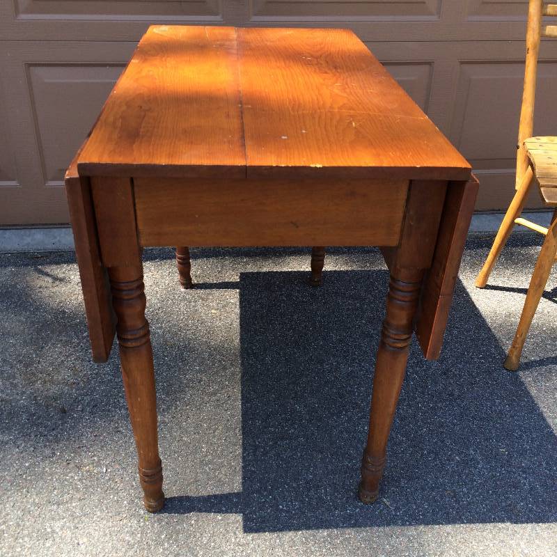 lot 32 image: Beverlys Original Familys Drop Leaf Table...Her Family Had 9 Children And All Would Vie For A Place At This Gorgeous Antique Primitive Table.  Approximate Age Over 75 Years