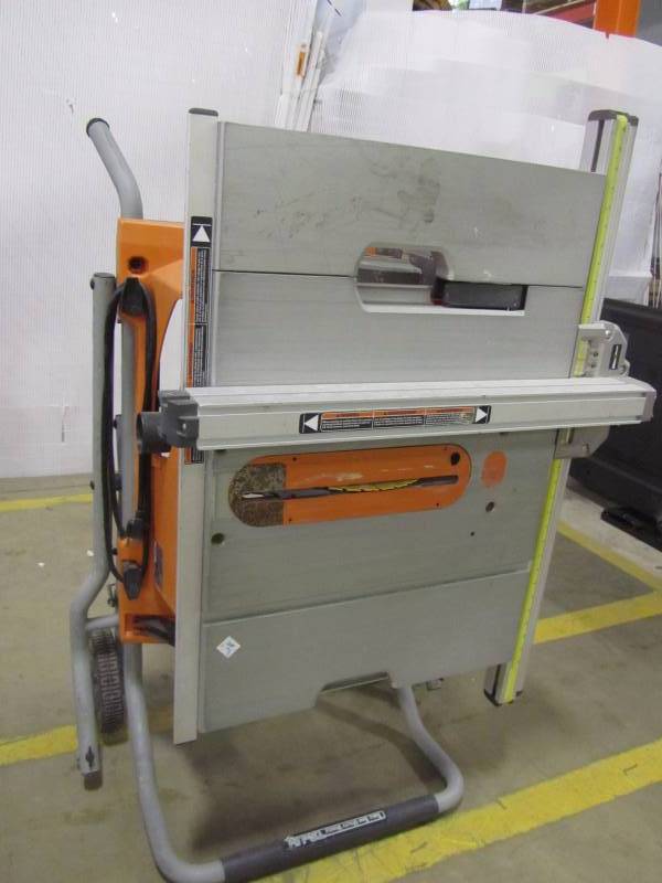 lot 19 image: Ridgid 15 amp 10 heavy duty portable table saw