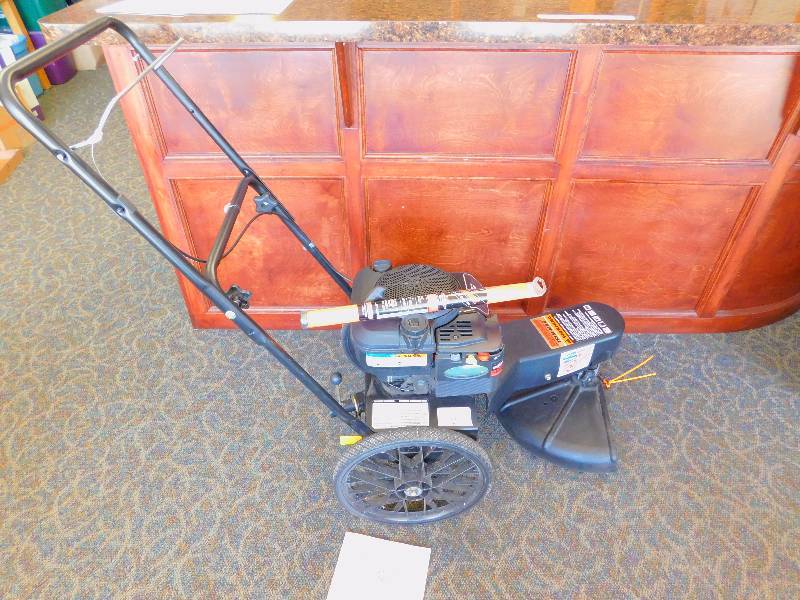lot 2 image: 22 Walk-Behind Trim-N-Mow Plus Gas String Trimmer