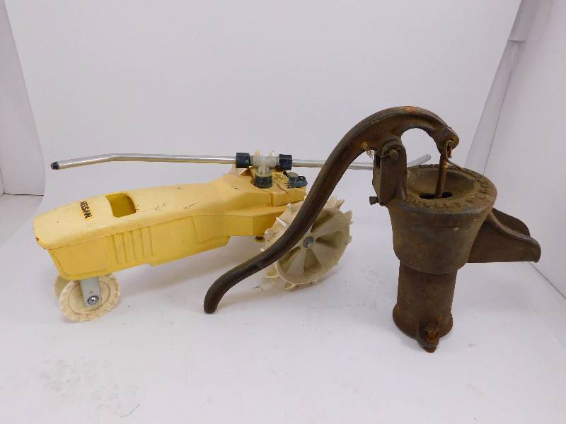 lot 36 image: Traveling Lawn TractorSprinkler and Vintage Well Pump