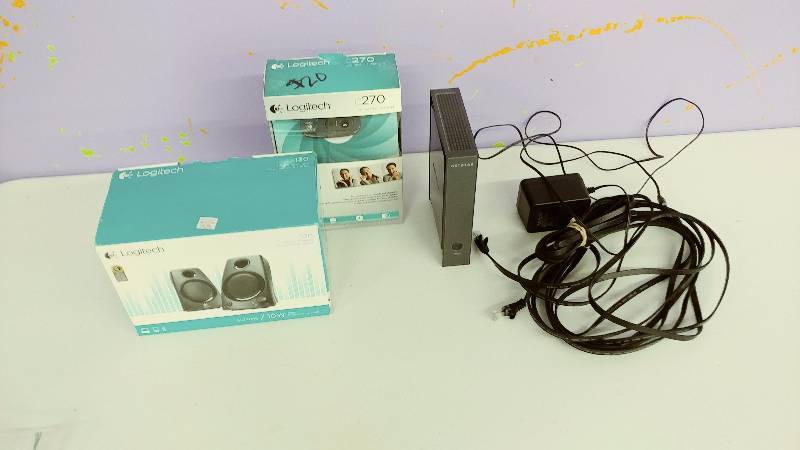 lot 46 image: Speakers, HD Webcam, and Router